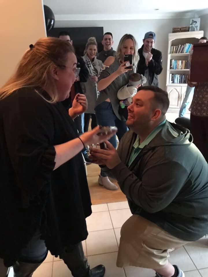 Groom proposing to his bride